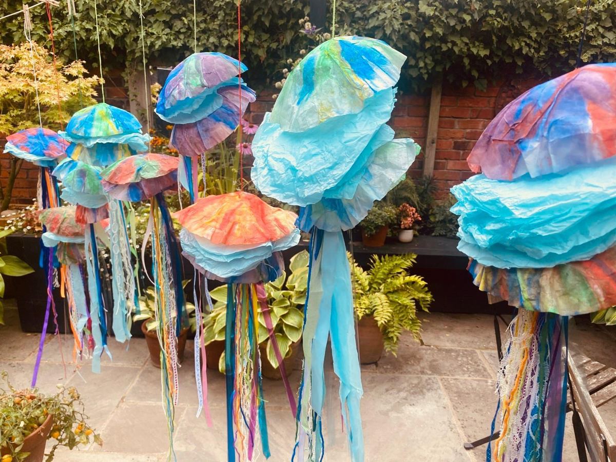 Tissue paper and ribbon jellyfish hanging in the garden