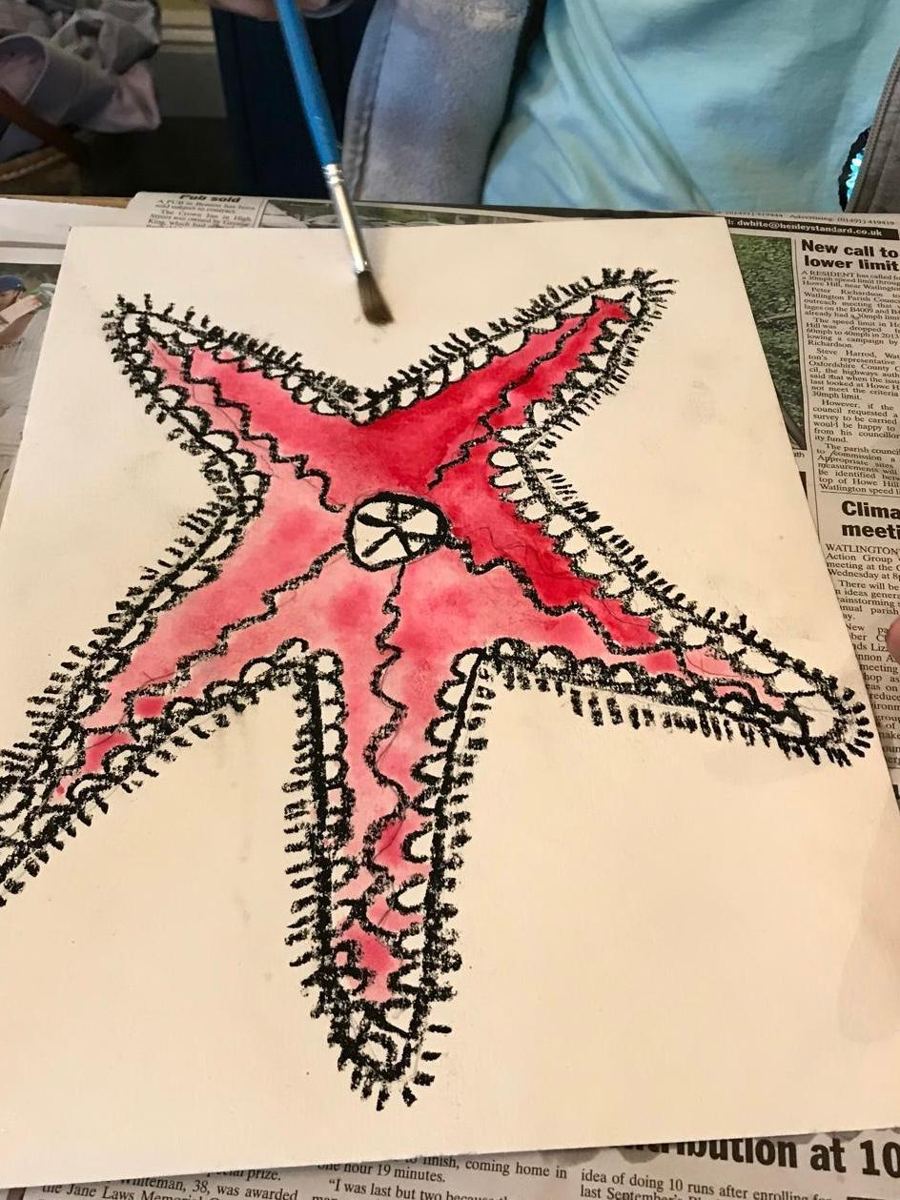 A wax resist starfish painted pink