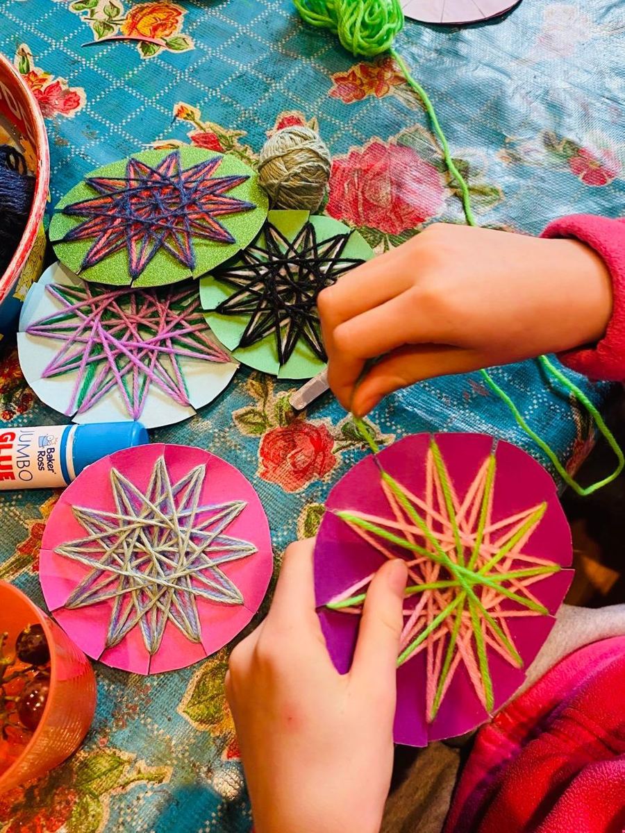 String stars woven on card circles